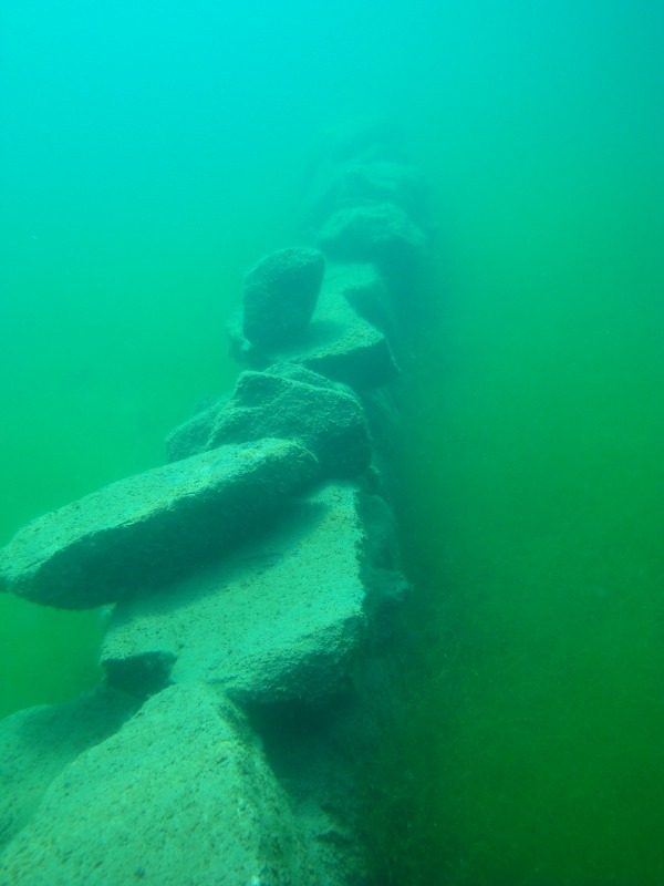 Underwater stone wall