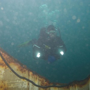 Author glides through a hole in a wreck