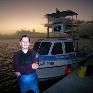 Jackey gets ready for a night dive on Paradise Reef