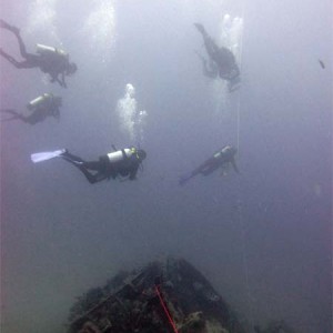 Divers above ballast tank