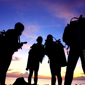 Sunrise divers gear up before shore entry to USS Liberty Wreck, Tulamben, Bali